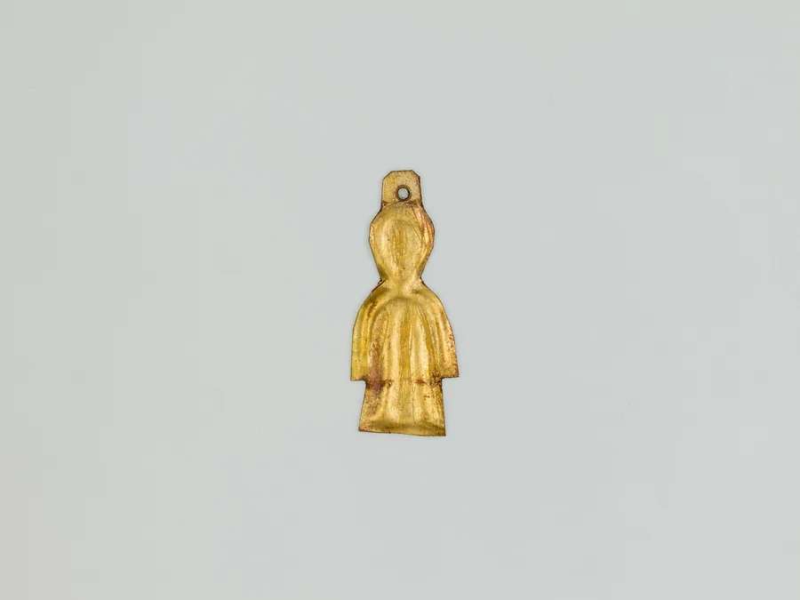 Small Egyptian gold-sheet Tit or Isis-knot amulet.