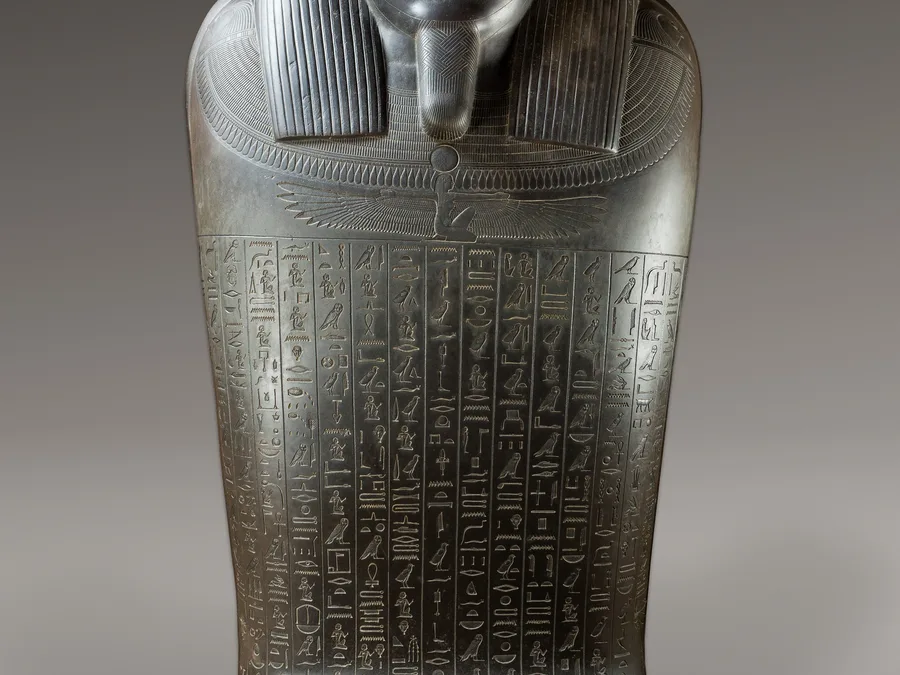 Large Egyptian greywacke sarcophagus of Harkhebit with carved funerary inscriptions.