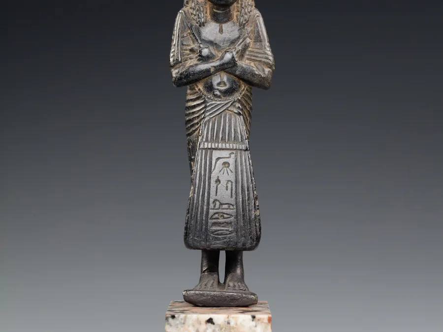 Ancient Egyptian shabti figure of Sherinefer in dark stone.
